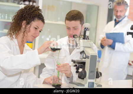 young scientist doing experiments in lab Stock Photo