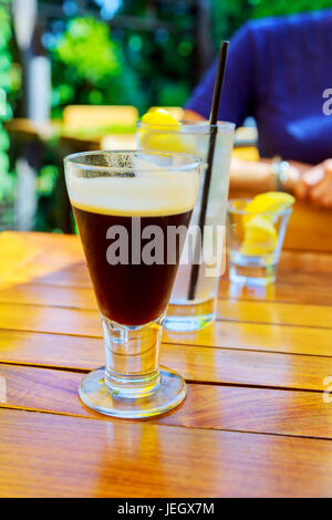 Latte Coffee or caffe latte in tall latte glasses with table settings Stock Photo