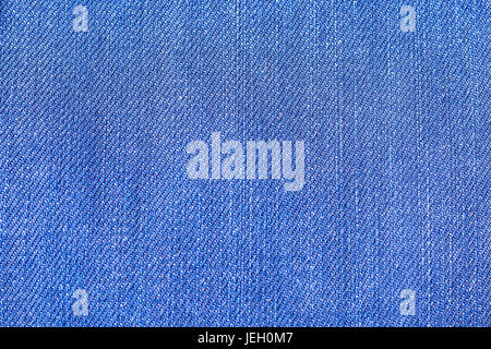 Small blue  jeans fabric fibres close up from above Stock Photo