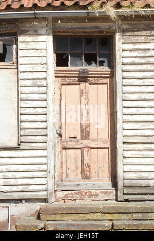 old door on an old condemned wooden house Stock Photo