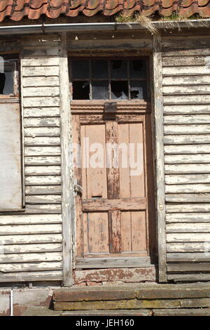 old door on an old condemned wooden house Stock Photo