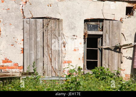 old doors on an old condemned wooden house Stock Photo