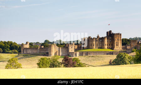 Alnwick castle located in Northumberland, Northern England.  The medieval castle has been used in many films including the Harry Potter films. Stock Photo