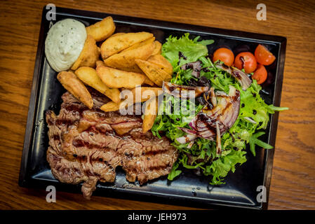 Meal at Campo de Ourique urban food market; Lisbon, Portugal Stock Photo