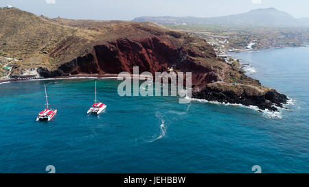 Aerial view of Red beach with catamarans in Santorini, Greece Stock Photo