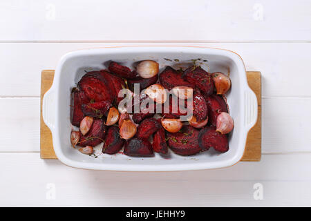 freshly baked beetroot with garlic in baking dish Stock Photo