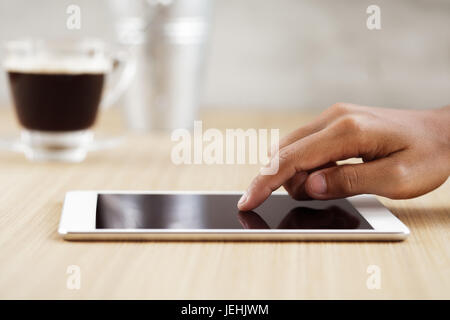 selective focus finger touching on digital tablet Stock Photo