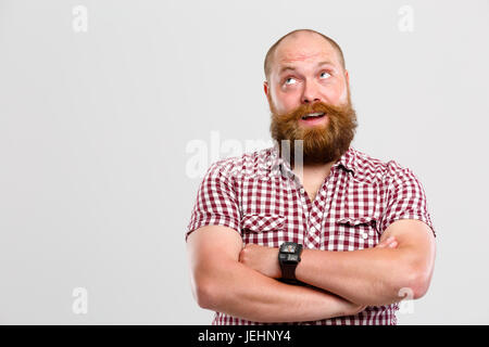 Thoughtful man with ginger beard Stock Photo