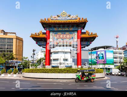 BANGKOK, THAILAND - APRIL 24: Traditional Thai taxi with Chinatown Gate on background on April 24, 2016 in Bangkok, Thailand. Stock Photo