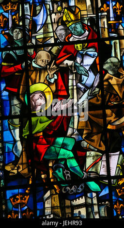 Stained glass in the cathedral of Rouen, France, depicting the Trial of Joan of Arc Stock Photo