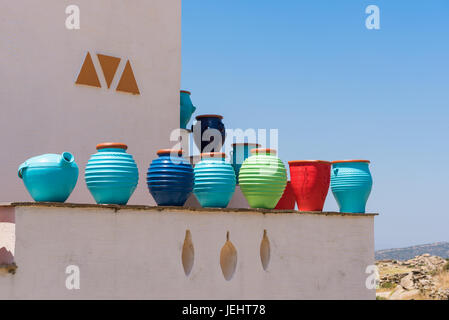 Traditional colorful Greek flower pots on Naxos island. Cyclades. Greece Stock Photo
