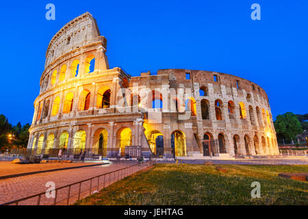 Night view of the Colosseum, an elliptical amphitheatre in the centre of Rome,Italy.Built of concrete and stone,it was the largest amphitheatre of the Stock Photo