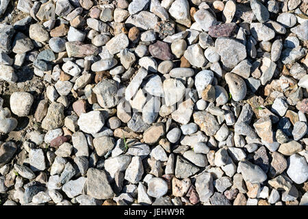 Background pattern, Crushed stone and small stones filled with sun Stock Photo