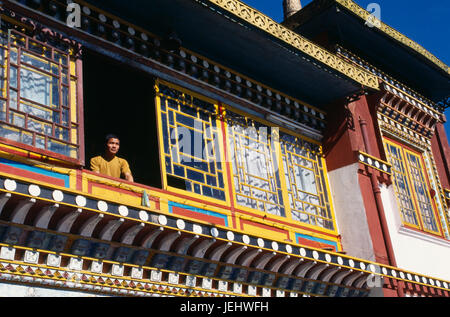 India, West Bengal, Darjeeling, Monk at window of Bhutia Busty monastery. Stock Photo