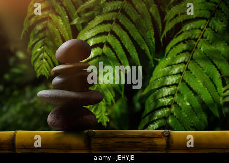 Stack of Zen stones on abstract dark background of ...