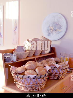 Beautiful composition with bread and buns in wicker basket Stock Photo