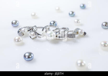 Rings and earrings with pearls Stock Photo