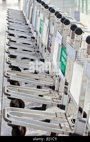 BEIJING – OCT.13, 2011. Lined up baggage trolleys at Beijing Capital International Airport. Stock Photo