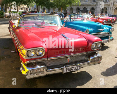 HAVANA, CUBA - APRIL 18: Vintage american classic cars parked in the main street of Old Havana, on April 18, 2016 in Havana Stock Photo