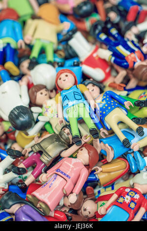 ANTWERPEN-FEB. 12, 2017. Pile of multi colored small puppets in a market stall. There’s a renewed interest for toys and games from decades ago. Stock Photo