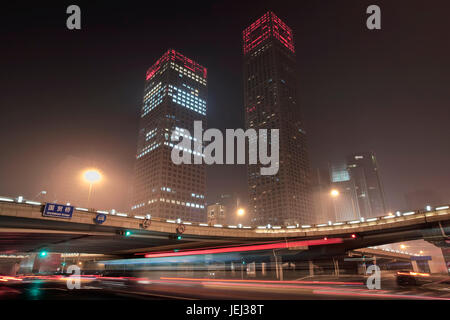 BEIJING – OCT. 24, 2009. Traffic rushes at Guomao, one of Beijing’s busiest intersections. It is located in Beijing Central Business District. Stock Photo