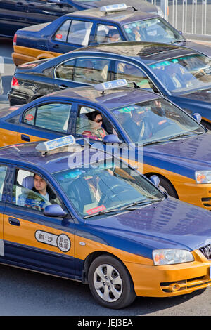 BEIJING – OCT. 17, 2011. Beijing taxis in traffic congestion. They are convenient and inexpensive. Over 70,000 taxis running daily in the city. Stock Photo