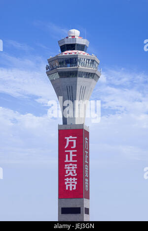 BEIJING-JULY 15, 2016. Traffic tower at Beijing Capital Airport, Terminal 2. It has a floor area of 336,000 m2 and can handle twenty aircraft at docks. Stock Photo