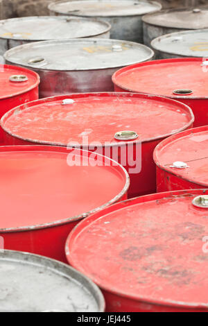 Red and silver colored empty oil-drums Stock Photo