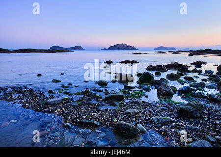 Bay with cobblestones, pebbles and islands at twilight in Dalian, Liaoning Province, China Stock Photo