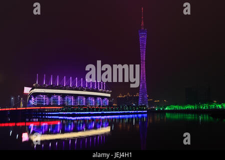 GUANGZHOU-FEB. 21, 2012. Asian Games stadium with TV tower on Feb. 21, 2012 in Guangzhou. The 16th Asian Games ceremony has been held at Nov. 12, 2010 Stock Photo