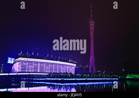 GUANGZHOU-FEB. 21, 2012. Asian Games stadium with TV tower on Feb. 21, 2012 in Guangzhou. The 16th Asian Games ceremony has been held at Nov. 12, 2010 Stock Photo