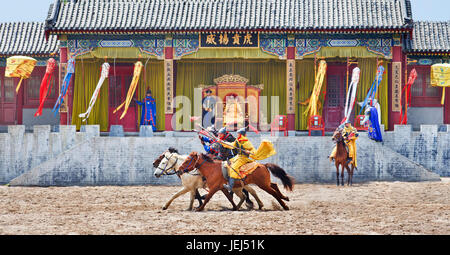 HENGDIAN-CHINA-APRIL 14, 2014. Ancient style horse show at Hengdian World Studios. With 495,995 sq. meter the largest movie town in Asia. Stock Photo