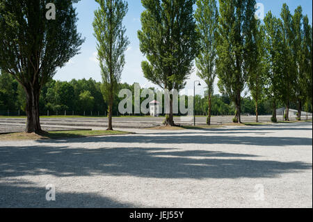 03.06.2017, Dachau, Bavaria, Germany, Europe - Looking from the camp road at a watch tower and security installations at the Memorial Site in Dachau. Stock Photo