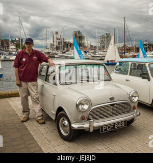 Ipswich, UK. 25th June, 2017. A large number of classic mini cars gathered on Ipswich Waterfront Quay following a treasure hunt organised by the Ipswich & Suffolk Mini Owners Club, ISMOC.  Other mini clubs across the region including Colchester and Bury St Edmunds joined this event to celebrate this iconic car. This  mini  came  off  the   assembly  line  on  21st June  196o.  it  is  an  Austin Mini  Delux  as  it  is  fitted  with  a  heater  the  standard  model  did  not  have  one.  The  engine  is  848cc  and  is  standard  fitted  with  new  bearings  and has a top  speed around 70mph.  Stock Photo