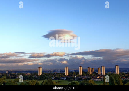 Glasgow, Scotland, UK, 25th June Strange UFO huge mothership shape over the city, Lenticular clouds Altocumulus lenticularis are stationary lens-shaped clouds that form in the troposphere Credit: Gerard Ferry/Alamy Live News Stock Photo