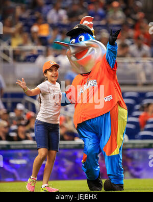 Miami Marlins Mascot Billy the Marlin celebrates on the dugout after the  2nd inning against the New York Yankees in their first exhibition game at  the new Marlins Ball Park April 1