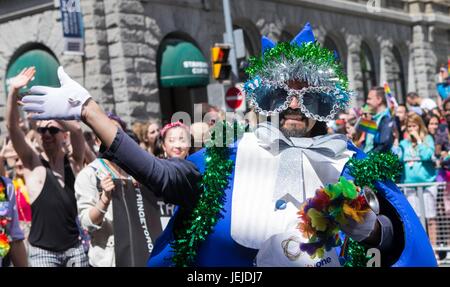 Toronto, Canada. 25th June, 2017. A participant waves to people during the 2017 Pride Parade in Toronto, Canada, June 25, 2017. Credit: Zou Zheng/Xinhua/Alamy Live News Stock Photo