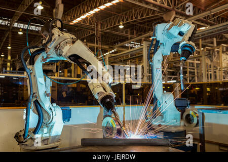 Industrial robots are welding part Stock Photo