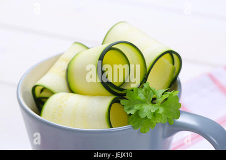 cup of raw zucchini strips - close up Stock Photo