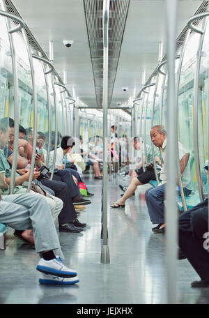 BEIJING-JUNE 2, 2015. Inside a subway car. Rapid transit rail network that serves Beijing urban and suburban districts, 18 lines and 319 stations. Stock Photo