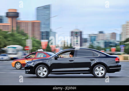 BEIJING-SEPT. 20. New Volkswagen Passat B7 downtown. Passat is a large family car marketed through six design generations since 1973. Stock Photo