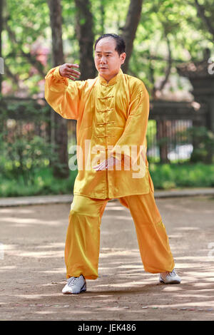 XI’AN-MAY 21. Chinese man practice Tai Chi. Tai Chi Chuan means 'Supreme Ultimate Fist” and is a popular martial art in China. Stock Photo