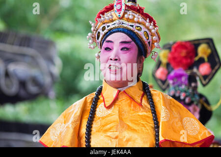 YANGZHOU, CHINA – SEPT. 26, 2010. Chinese opera performance at He Garden. Chinese opera is a form of drama and musical theater with ancient roots. Stock Photo