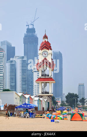 YANTAI-CHINA-JULY 17. Beach with skyscrapers on the background. Because of its coasts and tourist sites Yantai is a very popular travel destination. Stock Photo