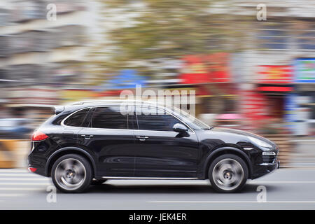 YIWU-CHINA-JAN. 15, 2016. Black Porsche Cayenne. Since 2010, Porsche has tripled sales in China. Stock Photo