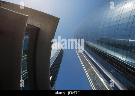 Looking straight up at the Etihad Towers in Abu Dhabi. The proximity of the sun gives some lens flare. Stock Photo