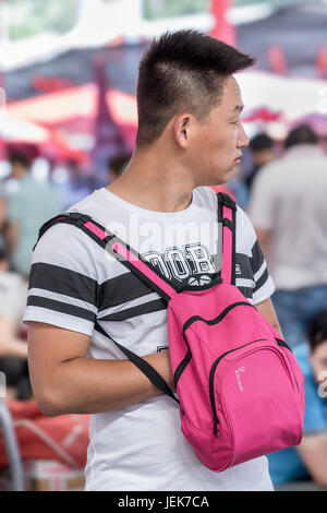 BEIJING-MAY 29, 2016. Visitor at Panjiayuan market, the largest market selling antiques, crafts, collectibles and decorations in China. Stock Photo