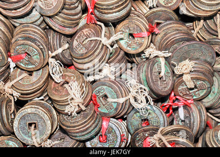 Tied ancient Chinese coins displayed on Panjiayuan Market, Beijing, China Stock Photo