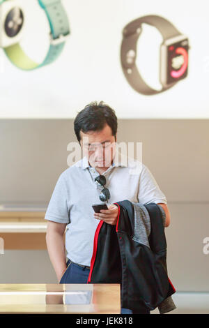 BEIJING-MAY 4, 2106. Man inside Apple store. China is very important to Apple, its billion-plus market has vast growth potential. Stock Photo