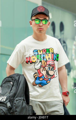 BEIJING-MAY 21, 2016. Cool fashionable young man. China’s economy, boosted by middle class wealth, undergoes a significant shift in consumption. Stock Photo